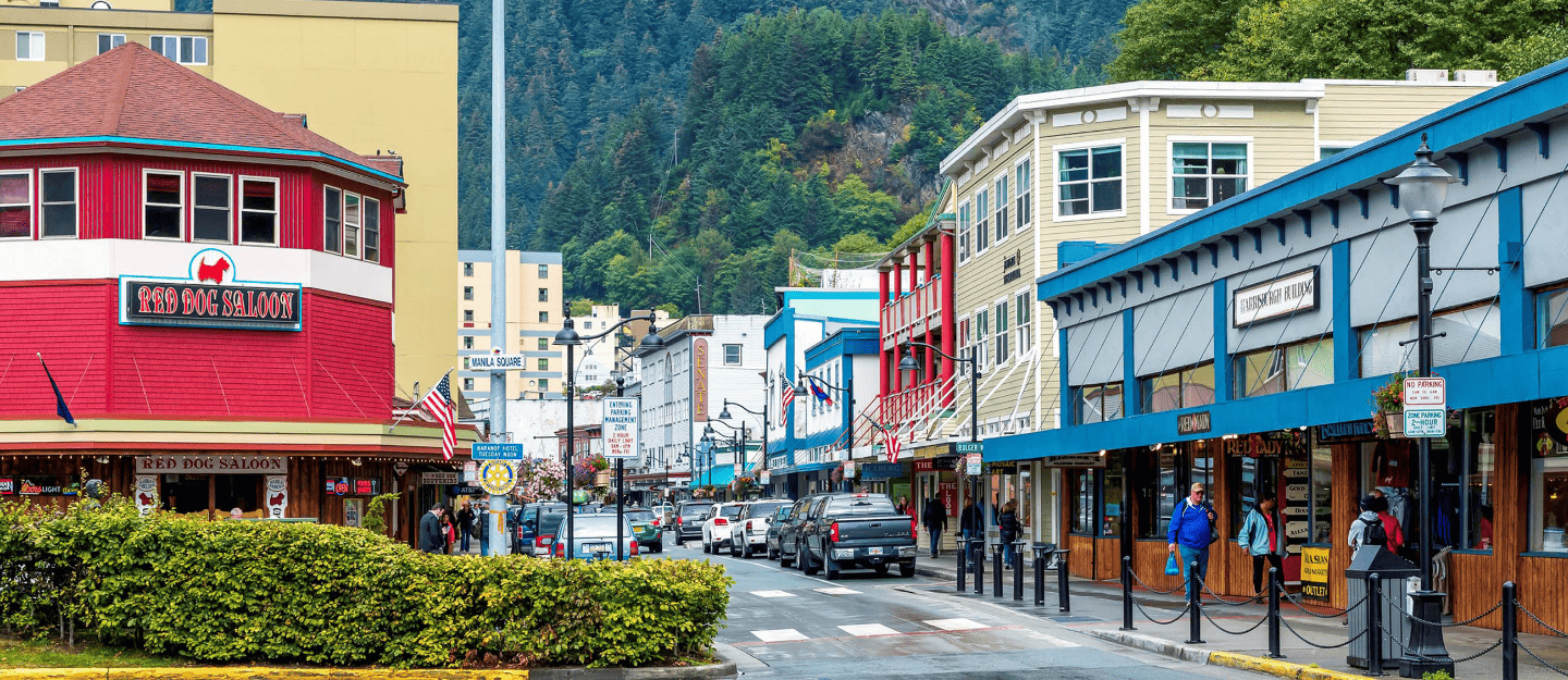 A magical Christmas street scene in North Pole, Alaska, featuring candy cane lights and festive decorations